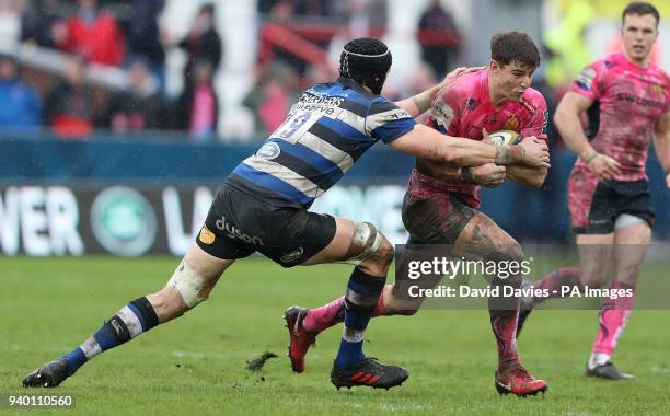 Exeter's Ollie Devoto is tackled by Bath's Luke Charteris during the Anglo-Welsh Cup Final at Kingsholm, Gloucester.