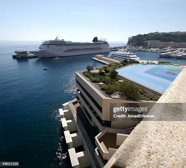 monaco cruise ship and fairmont hotel in monte carlo - monte carlo cruise stock pictures, royalty-free photos & images