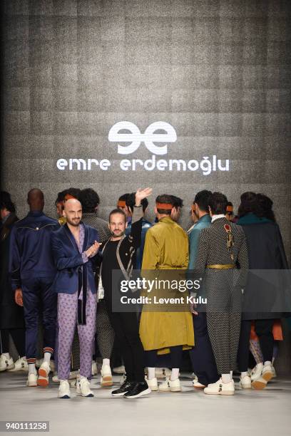 Fashion designer Emre Erdemoglu and singer Soner Sarikabadayi walk the runway at the Emre Erdemoglu show during Mercedes Benz Fashion Week Istanbul...