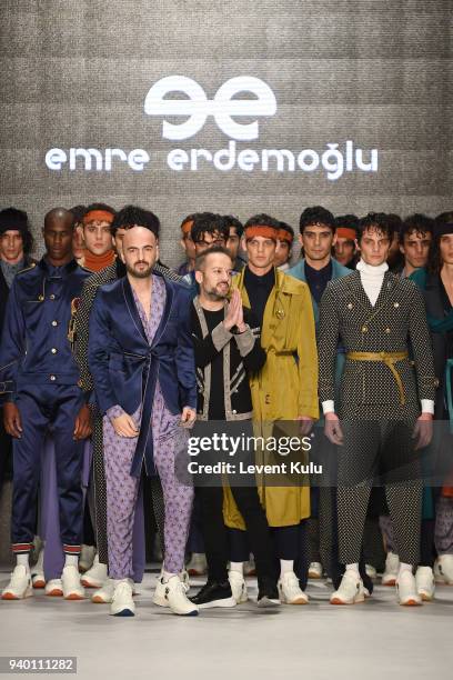 Fashion designer Emre Erdemoglu and singer Soner Sarikabadayi walk the runway at the Emre Erdemoglu show during Mercedes Benz Fashion Week Istanbul...