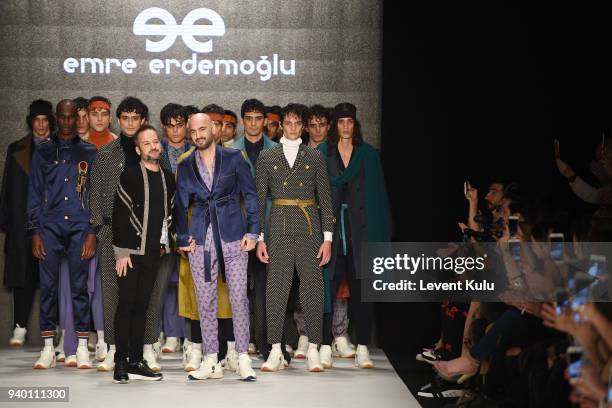 Fashion designer Emre Erdemoglu and singer Soner Sarikabadayi walk the runway at the Emre Erdemoglu show during Mercedes Benz Fashion Week Istanbul...