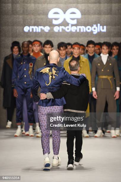 Singer Soner Sarikabadayi and fashion designer Emre Erdemoglu walk the runway at the Emre Erdemoglu show during Mercedes Benz Fashion Week Istanbul...