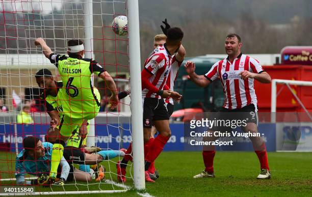 Exeter City's Jordan Tillson clears the ball off the goal line following an effort by Lincoln City's Elliott Whitehouse during the Sky Bet League Two...