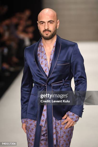 Soner Sarikabadayi walks the runway at the Emre Erdemoglu show during Mercedes Benz Fashion Week Istanbul at Zorlu Performance Hall on March 30, 2018...