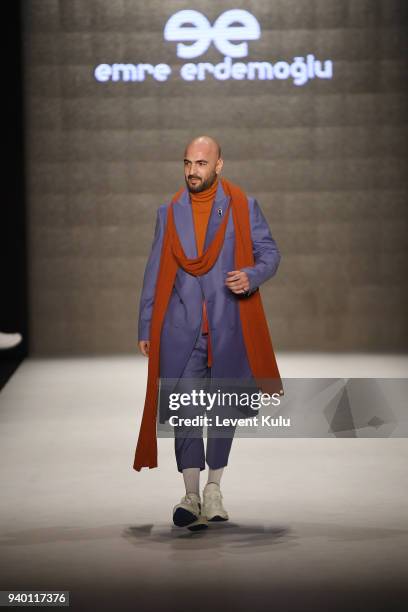 Soner Sarikabadayi walks the runway at the Emre Erdemoglu show during Mercedes Benz Fashion Week Istanbul at Zorlu Performance Hall on March 30, 2018...