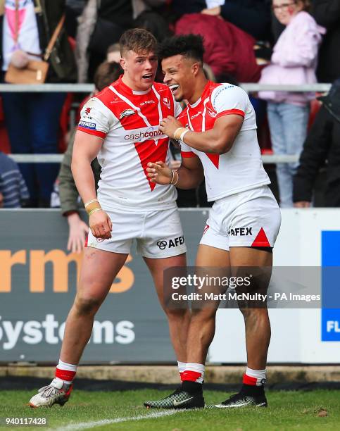 St Helens' Regan Grace celebrates with teammates after scoring a late try during the Super League match at the Totally Wicked Stadium, St Helens.