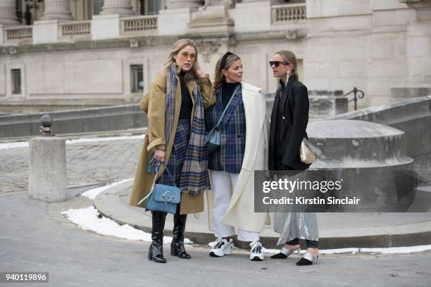 Fashion blogger Annabel Rosendahl wears a JW Anderson bag, TIBI coat, Victoria Beckham sunglasses, Acne scarf, boots and skirt with TV Host and...