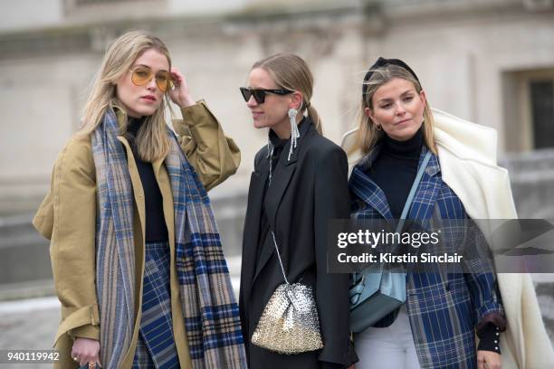 Fashion blogger Annabel Rosendahl wears a TIBI coat, Victoria Beckham sunglasses, Acne scarf and skirt with Fashion blogger Celine Aagaard wearing...