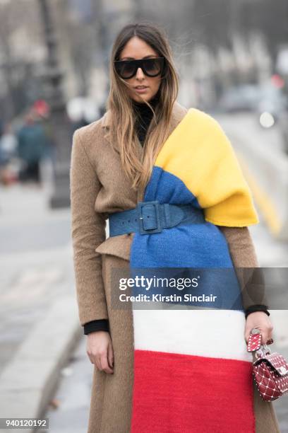 Fashion blogger Elisa Taviti wears a Valentino bag, Pace Style Concept coat, Asos scarf, Céline sunglasses and a Miu miu belt day 4 of Paris Womens...