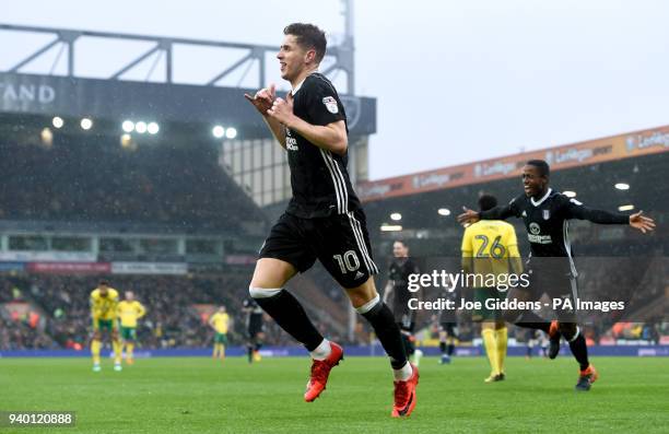 Fulham's Tom Cairney celebrates scoring his side's second goal of the game during the Sky Bet Championship match at Carrow Road, Norwich.