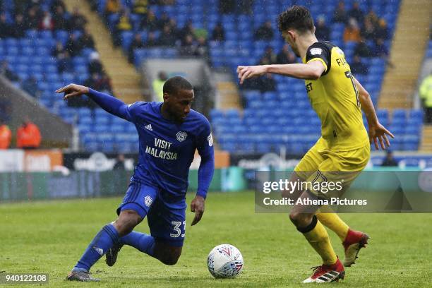 Junior Hoilett of Cardiff City is marked by Tom Flanagan of Burton Albion during the Sky Bet Championship match between Cardiff City and Burton...