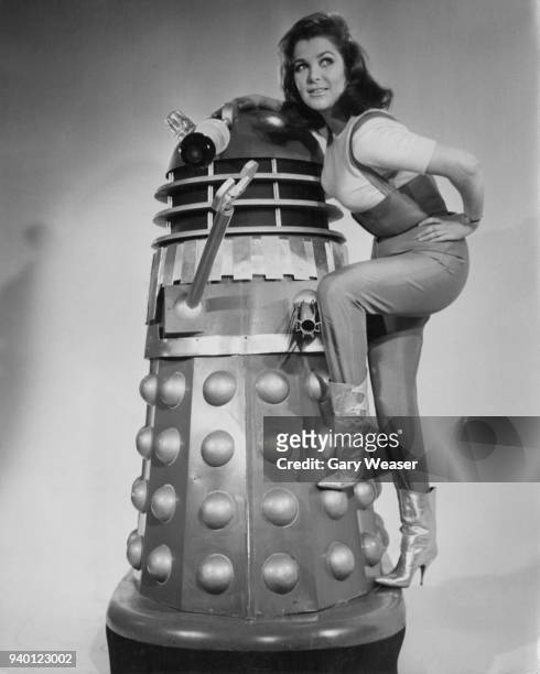 English actress Jill Curzon poses with a Dalek at Shepperton Studios, UK, 19th January 1966. She will star with the metal menace in the Doctor Who...