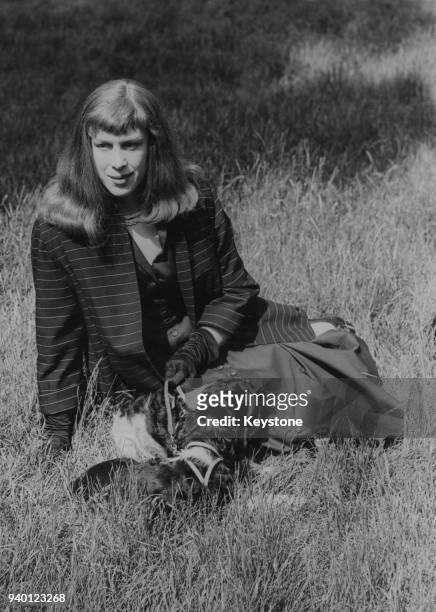 Former wartime fighter pilot Roberta Cowell with her dogs in Kensington Gardens, London, 21st June 1954. She was the first known British woman to...