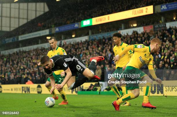 Tom Cairney of Fulham is fouled by Harrison Reed of Norwich City during the Sky Bet Championship match between Norwich City and Fulham at Carrow Road...