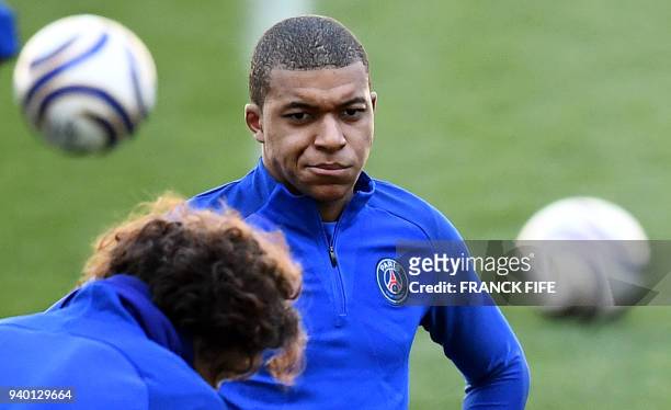 Paris Saint-Germain's French forward Kylian Mbappe looks on during a training session at the Matmut Atlantique Stadium in Bordeaux, southwestern...