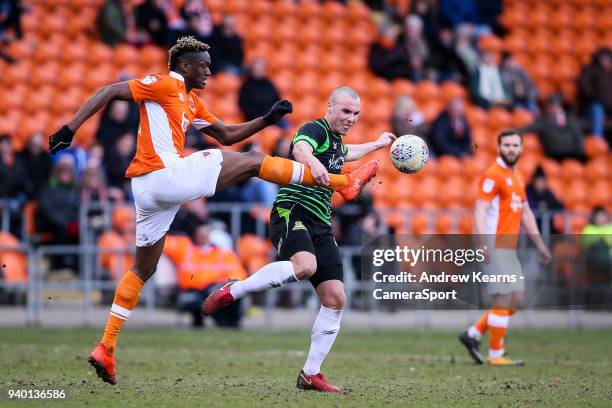 Blackpool's Armand Gnanduillet competing with Doncaster Rovers' Luke McCulloughduring the Sky Bet League One match between Blackpool and Doncaster...