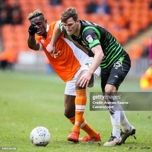 Blackpool's Armand Gnanduillet competing with Doncaster Rovers' Joe Wright during the Sky Bet League One match between Blackpool and Doncaster Rovers...