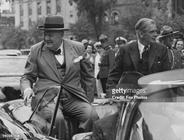 British Prime Minister Winston Churchill and Foreign Secretary Anthony Eden leave the Ottawa Parliament building in Canada after talks with the...