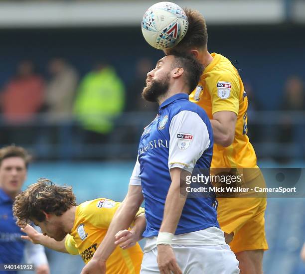 Preston North End's Sean Maguire jumps with Sheffield Wednesday's Atdhe Nuhiu during the Sky Bet Championship match between Sheffield Wednesday and...