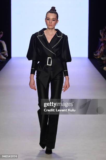 Model walks the runway at the Nihan Peker show during Mercedes Benz Fashion Week Istanbul at Zorlu Performance Hall on March 30, 2018 in Istanbul,...