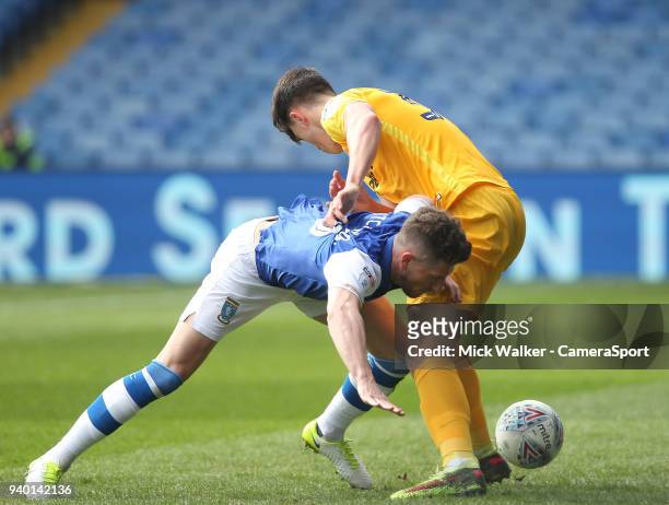 Preston North End's Josh Earl battles with Sheffield Wednesday's Sam Hutchinson during the Sky Bet Championship match between Sheffield Wednesday and...