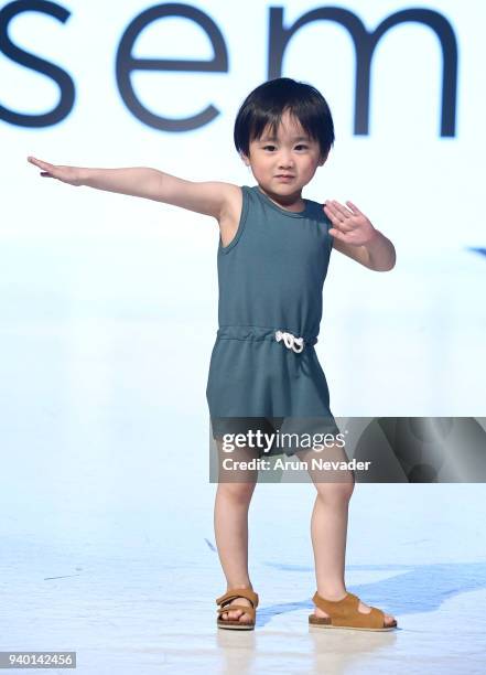 Model walks the runway wearing Sem Label at 2018 Vancouver Fashion Week - Day 6 on March 24, 2018 in Vancouver, Canada.