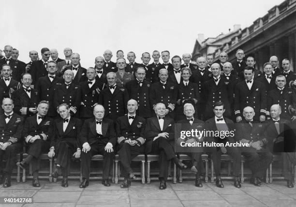 British Prime Minister Winston Churchill with British and US naval chiefs on the steps of the Painted Hall in Greenwich, London, 25th July 1942....