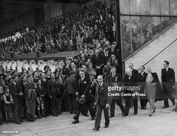 British Prime Minister Winston Churchill and his wife Clementine arrive at Walthamstow Stadium in London for his final election speech, 3rd July 1945.