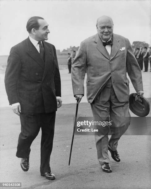 British Prime Minister Winston Churchill meets Pierre Mendès France , the French Prime Minister upon the latter's arrival at Biggin Hill RAF Station...