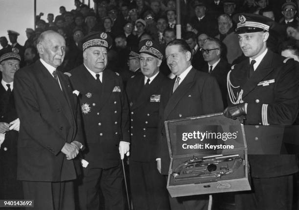 Michel Clemenceau , son of the late French Prime Minister Georges Clemenceau, hands over his father's duelling pistols to Alain Poher , the French...