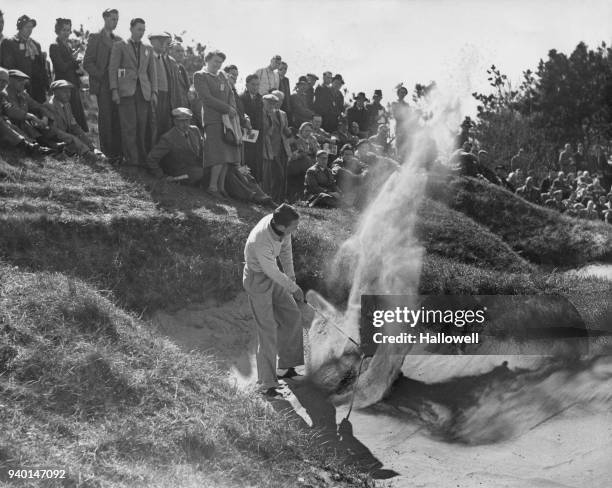 American golfer Charles Coe plays from a sand bunker approaching the 10th green during the Walker Cup Golf Tournament at Birkdale, UK, 11th May 1951.