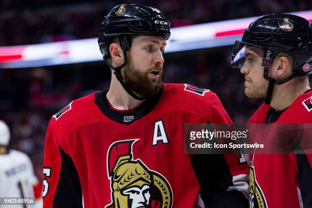 Ottawa Senators Center Zack Smith talks to Ottawa Senators Defenceman Mark Borowiecki prior to a face-off during third period National Hockey League...
