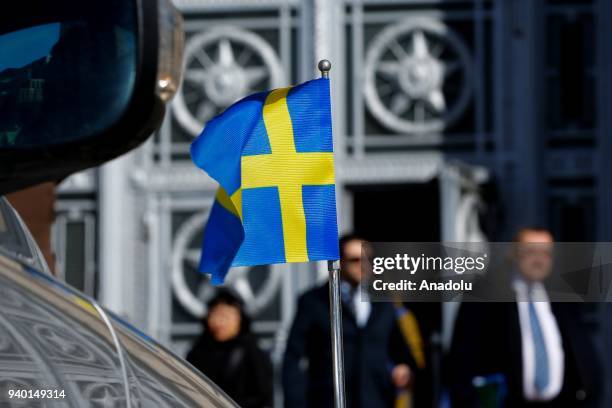 Flag on car of Swedish Embassy is seen in front of Russian Foreign Ministry building in Moscow, Russia on March 30, 2018. The countries that are to...