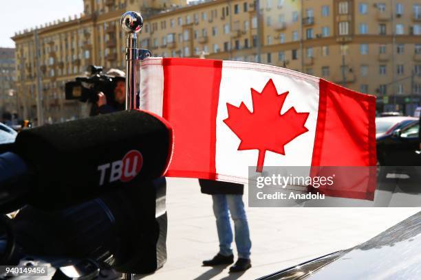 Flag on the car of Canadian Ambassador is seen in front of Russian Foreign Ministry building in Moscow, Russia on March 30, 2018. The countries that...