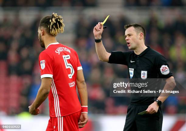 Middlesbrough's Ryan Shotton is booked by match referee Stuart Atwell during the Sky Bet Championship match at Riverside Stadium, Middlesbrough.