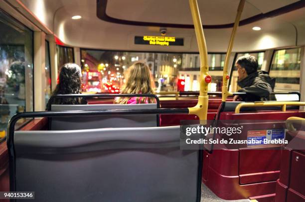 family on a london bus. father and daughters travel together. - london bus stock pictures, royalty-free photos & images