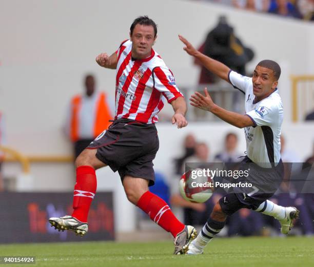 Andy Reid of Sunderland and Aaron Lennon of Tottenham Hotspur in action during the Barclays Premier League match between Tottenham Hotspur and...