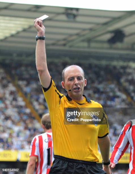 Referee Mike Dean in action during the Barclays Premier League match between Tottenham Hotspur and Sunderland at White Hart Lane in London on August...