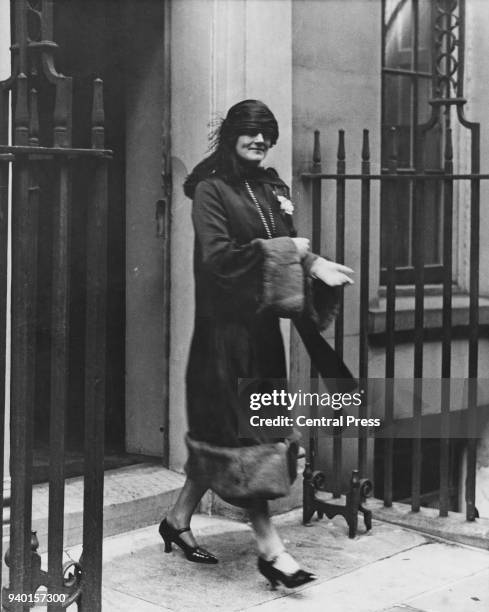Clementine Churchill , the wife of Chancellor of the Exchequer Winston Churchill, leaves Downing Street to listen to her husband's budget speech of...
