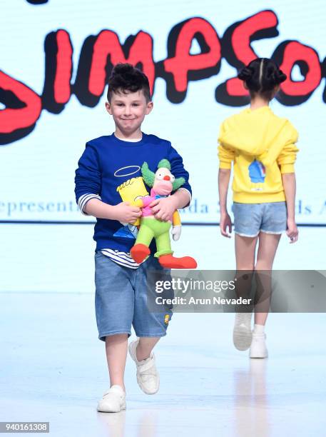 Model walks the runway wearing The Simpsons at 2018 Vancouver Fashion Week - Day 6 on March 24, 2018 in Vancouver, Canada.