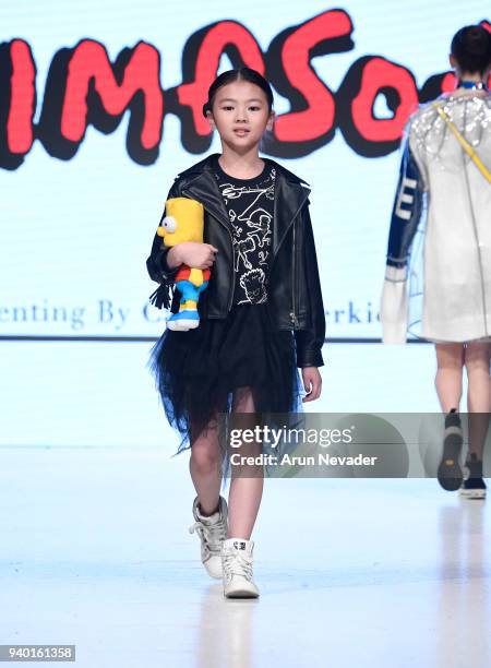 Model walks the runway wearing The Simpsons at 2018 Vancouver Fashion Week - Day 6 on March 24, 2018 in Vancouver, Canada.