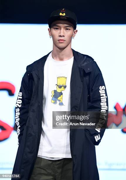 Model walks the runway wearing The Simpsons at 2018 Vancouver Fashion Week - Day 6 on March 24, 2018 in Vancouver, Canada.