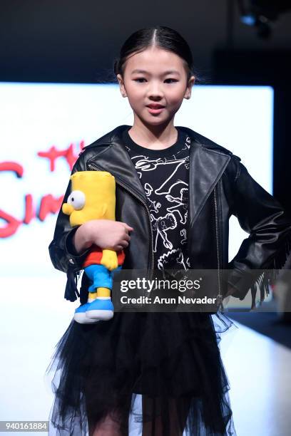 Model walks the runway wearing The Simpsons at 2018 Vancouver Fashion Week - Day 6 on March 24, 2018 in Vancouver, Canada.