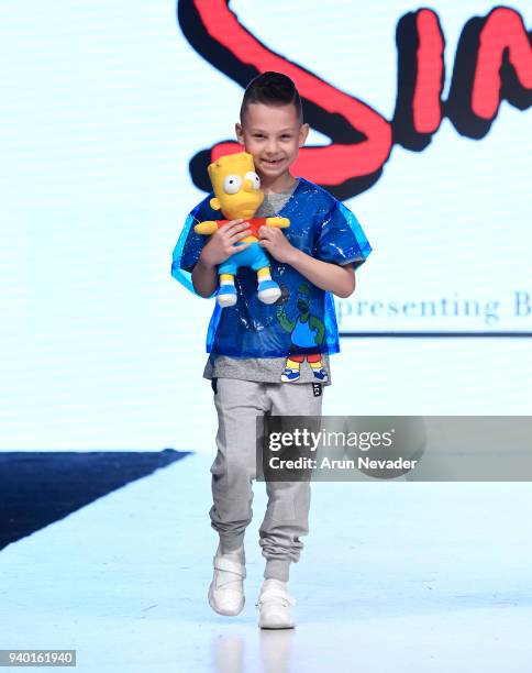 Model walks the runway wearing The Simpsons at 2018 Vancouver Fashion Week - Day 6 on March 24, 2018 in Vancouver, Canada.