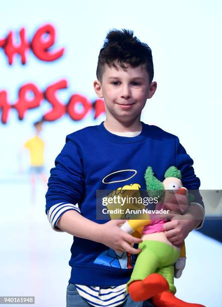 Model walks the runway wearing The Simpsons at 2018 Vancouver Fashion Week - Day 6 on March 24, 2018 in Vancouver, Canada.