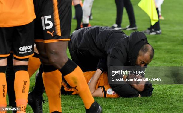 Nuno Espirito Santo manager / head coach of Wolverhampton Wanderers celebrates with Romain Saiss of Wolverhampton Wanderers at full time during the...