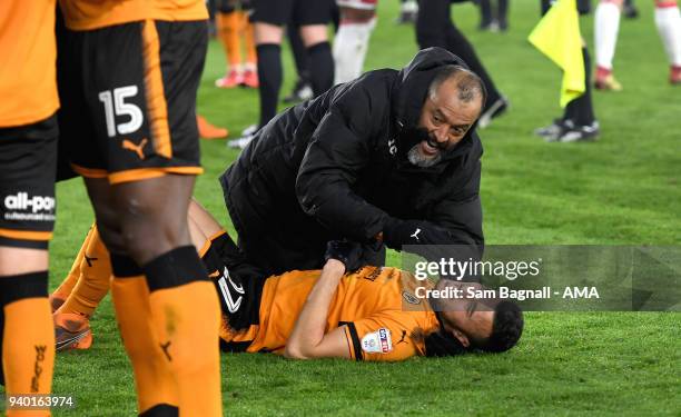 Nuno Espirito Santo manager / head coach of Wolverhampton Wanderers celebrates with Romain Saiss of Wolverhampton Wanderers at full time during the...