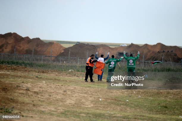 Palestinian medics evacuated an injured man during a demonstration near the border with Israel east of Jabalya in the Gaza Strip to commemorate the...