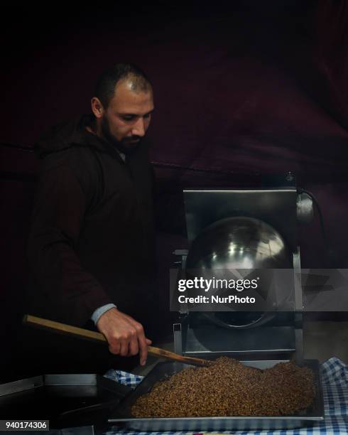 Man in a stand selling tradicional food during the III Medieval Festival at Parque da Vila in Quinta do Conde, outskirts of Lisbon, on March 30,...