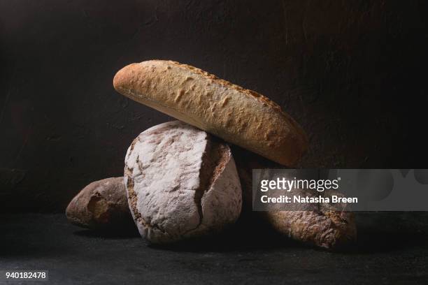 artisan rye and whole grain bread - dark bread stock pictures, royalty-free photos & images